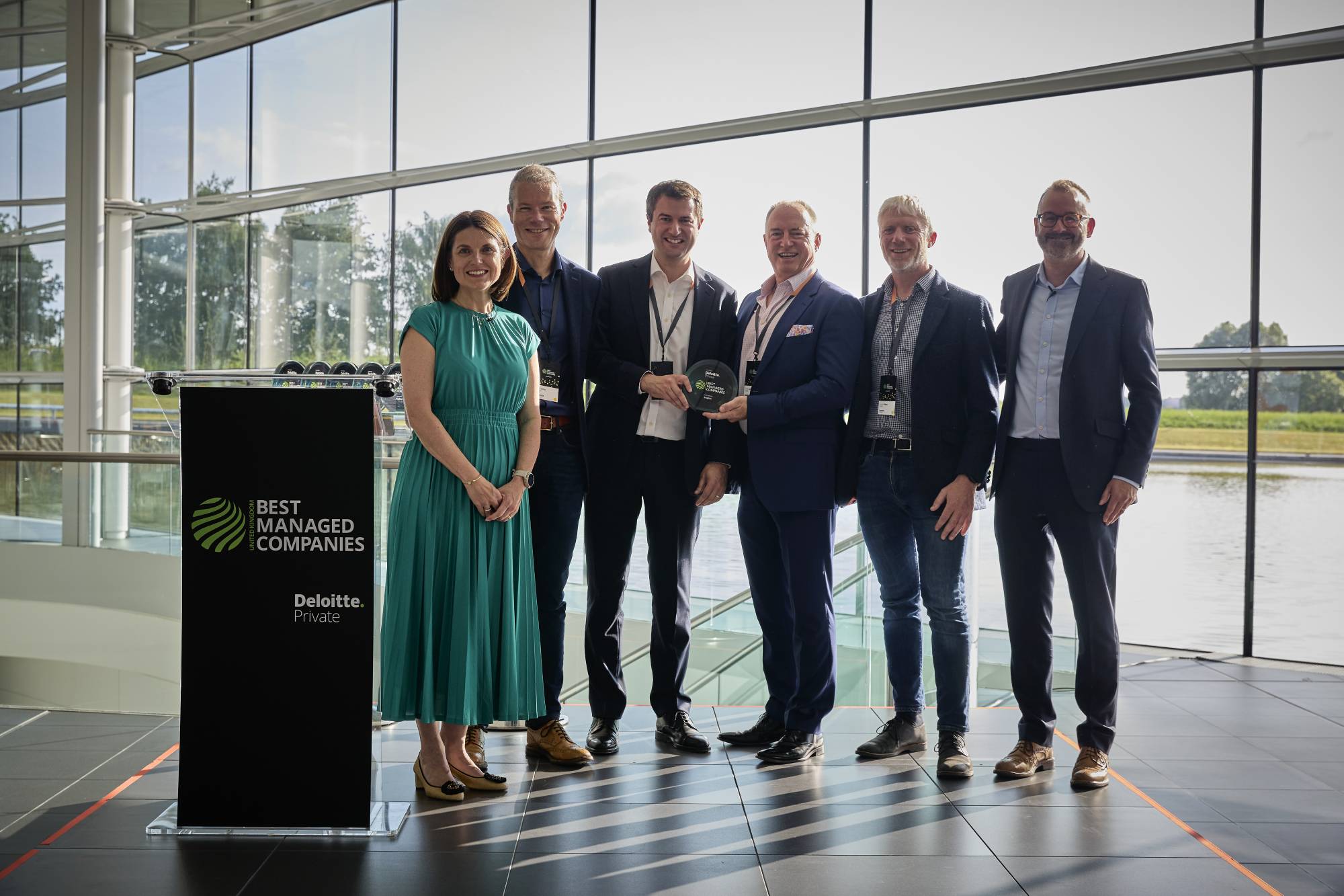 Award Winners: Insights executive leadership team accepts the Best Managed Company award